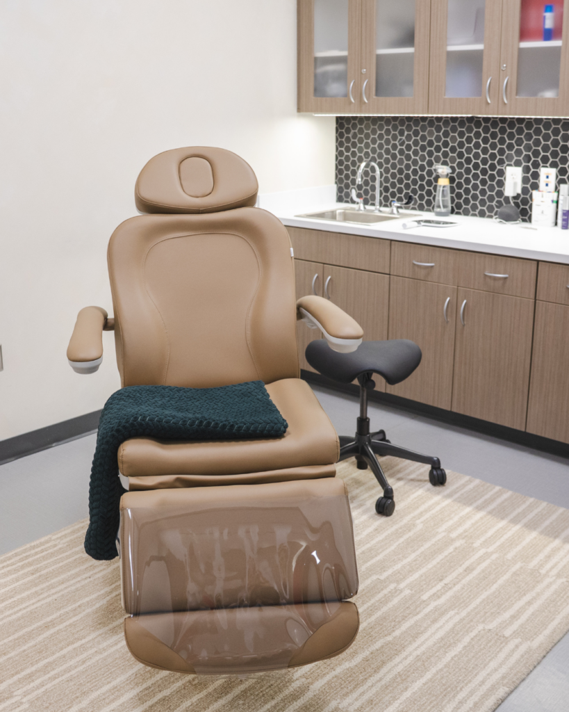 Modern cosmetic injection treatment room at Pine & River Aesthetics in Little Rock, Arkansas, featuring a luxury patient treatment chair and private consultation space for facial balancing, dermal fillers, and neurotoxin treatments.